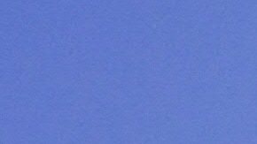 A pedestrian uses an umbrella while walking past City Hall in Los Angeles amid an ongoing heatwave on August 29, 2017, generating triple-digit temperatures in some southern California communities. Temperatures hit the mid 90F (34C). / AFP PHOTO / FREDERIC J. BROWN (Photo credit should read FREDERIC J. BROWN/AFP via Getty Images)