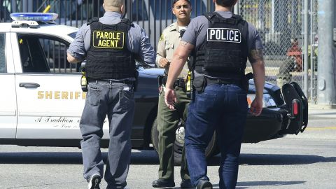 Police man an intersection May 11, 2018 following reports of shooting at Highland High School in Palmdale, 40 miles (65 kilometers) north of downtown Los Angeles. - Police arrested a man after reports of shootings at two schools near Los Angeles, the local sheriff's department and education officials said. The Los Angeles County Sheriff said one suspect had been detained "regarding the person with a gun" at Highland High School. Local news reports had earlier said that at least one person had been wounded. It was not immediately clear what type of weapon the man had. (Photo by Frederic J. BROWN / AFP) (Photo credit should read FREDERIC J. BROWN/AFP via Getty Images)