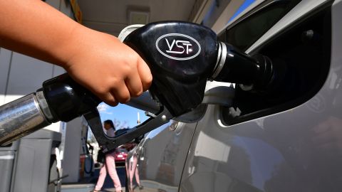 A child pumps gas for his father at a gas station in Los Angeles on April 9, 2019, as southern California gas prices, already the highest in the nation, continue to rise. (Photo by Frederic J. BROWN / AFP) (Photo credit should read FREDERIC J. BROWN/AFP via Getty Images)