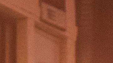 Firefighters gather near firetrucks after a fire in a single-story commercial building sparked an explosion in the Toy District of downtown Los Angeles on May 16, 2020. - At least 11 firefighters were injured in downtown Los Angeles when a fire in a commercial building sparked a major explosion and spread to nearby structures, fire officials said. Some 230 responders battled the blaze as it spread to other buildings in the area before it was extinguished around two hours after it began. (Photo by Apu GOMES / AFP) (Photo by APU GOMES/AFP via Getty Images)