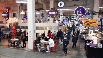 People enjoy lunch at Grand Central Market as indoor dining reopens in Los Angeles, on March 15, 2021. - Los Angeles and southern California is allowed to partially reopen indoor dining and movie theaters Governor Gavin Newsom announced last week, as the region hit key health criteria. Slammed by a brutal Covid-19 pandemic winter spike, California has seen a rapid decline in infection rates in recent weeks as a vaccination rollout has delivered at least one dose to nearly a fifth of residents. (Photo by Frederic J. BROWN / AFP) (Photo by FREDERIC J. BROWN/AFP via Getty Images)