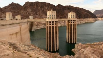 Intake towers for water to enter to generate electricity and provide hydroelectric power stand during low water levels due the western drought on July 19, 2021 at the Hoover Dam on the Colorado River at the Nevada and Arizona state border. - The Lake Mead reservoir formed by the Hoover Dam on the Nevada-Arizona border provides water to the Southwest, including nearby Las Vegas as well as Arizona and California, but has remained below full capacity since 1983 due to increased water demand and drought, conditions that are expected to continue. (Photo by Patrick T. FALLON / AFP) (Photo by PATRICK T. FALLON/AFP via Getty Images)