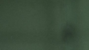 A cleaner wipes a display at the booth of Swiss manufacturer of luxury wristwatches Tudor, on the opening day of the Watches and Wonders Geneva show, in Geneva on March 30, 2022. - Switzerland's top luxury watch fair will resurface this week in Geneva after two years of pandemic-induced virtual shows, but Ukraine's raging conflict and Covid lockdowns in China could dampen the mood. (Photo by Fabrice COFFRINI / AFP) (Photo by FABRICE COFFRINI/AFP via Getty Images)