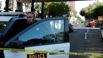 SACRAMENTO, CALIFORNIA APRIL 03: Police officers work the scene of a shooting on the corner of 10th and L street that occurred in the early morning hours on April 3, 2022 in Sacramento, California. Six people were killed and at least 10 were injured in the mass shooting in downtown Sacramento with no suspects in custody. (Photo by David Odisho/Getty Images)
