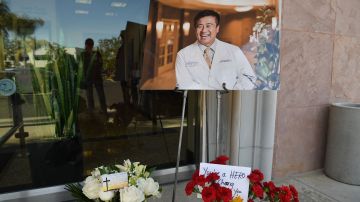 Flowers, cards and a photo of Dr. John Cheng are seen outside his office in Aliso Viejo, California, May 16, 2022. - Cheng, 52, a family and sports medicine doctor was killed protecting others when a gunman opened fire at church services he was attending in nearby Laguna Woods, California on May 15, 2022. Cheng charged the gunman in a bid to bring him to the ground, allowing others to hogtie him, but was fatally hit by the gunfire. (Photo by Robyn Beck / AFP) (Photo by ROBYN BECK/AFP via Getty Images)