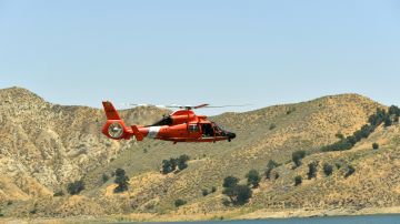 PIRU, CALIFORNIA - JULY 09: A U.S. Coast Guard helicopter flies over Lake Piru, where actress Naya Rivera was reported missing Wednesday, on July 9, 2020 in Piru, California. Rivera, known for her role in "Glee," was reported missing July 8 after her four-year-old son, Josey, was found alone in a boat rented by Rivera. The Ventura County Sheriff’s Department is coordinating a search and recovery operation. (Photo by Amy Sussman/Getty Images)