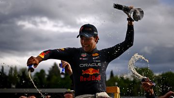 IMOLA, ITALY - APRIL 24: Second placed Sergio Perez of Mexico and Oracle Red Bull Racing celebrates with his team after the F1 Grand Prix of Emilia Romagna at Autodromo Enzo e Dino Ferrari on April 24, 2022 in Imola, Italy. (Photo by Clive Mason/Getty Images