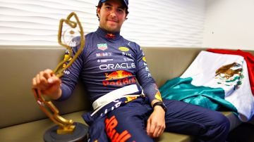 MONTE-CARLO, MONACO - MAY 29: Race winner Sergio Perez of Mexico and Oracle Red Bull Racing relaxes with his trophy after the F1 Grand Prix of Monaco at Circuit de Monaco on May 29, 2022 in Monte-Carlo, Monaco. (Photo by Mark Thompson/Getty Images)