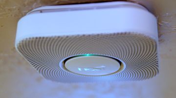 PROVO, UT - JANUARY 16: In this photo illustration, a Nest smoke and carbon monoxide detector installed in a home is seen on January 16, 2014 in Provo, Utah. Google bought Nest, a home automation company, for $3.2 billion taking Google further into the home ecosystem. (Photo illustration by George Frey/Getty Images)