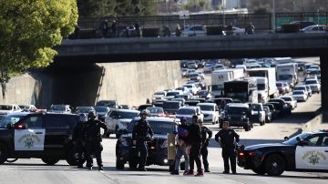 SACRAMENTO, CA - MARCH 22: California Highway Patrol officers confront a Black Lives Matter protester as he marches Interstate 5 during a demonstration on March 22, 2018 in Sacramento, California. Hundreds of protesters staged a demonstration against the Sacramento police department after two officers shot and killed Stephon Clark, an unarmed black man, in the backyard of his grandmother's house following a foot pursuit on Sunday evening. (Photo by Justin Sullivan/Getty Images)