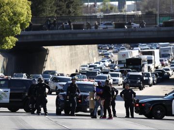 SACRAMENTO, CA - MARCH 22: California Highway Patrol officers confront a Black Lives Matter protester as he marches Interstate 5 during a demonstration on March 22, 2018 in Sacramento, California. Hundreds of protesters staged a demonstration against the Sacramento police department after two officers shot and killed Stephon Clark, an unarmed black man, in the backyard of his grandmother's house following a foot pursuit on Sunday evening. (Photo by Justin Sullivan/Getty Images)