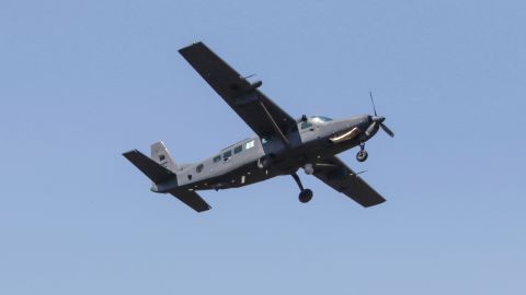 A Cessna 208 military aircraft flies over targets during a drill by the Lebanese Airforce in the northern Lebanese village of Hamat on April 11, 2019. - (Photo by Ibrahim CHALHOUB / AFP) (Photo credit should read IBRAHIM CHALHOUB/AFP via Getty Images)