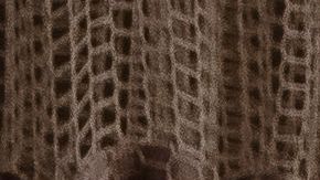 A health care worker tends to a Covid-19 patient while she is using a continuous positive airway pressure (CPAP) machine to help with her breathing difficulties in a Covid-19 holding pod at Providence St. Mary Medical Center in Apple Valley, California on January 11, 2021. - As Covid-19 tears through southern California, small hospitals in rural towns like Apple Valley have been overwhelmed, with coronavirus patients crammed into hallways, makeshift ICU beds and even the pediatric ward. When AFP visited St Mary hospital in this desert town of 70,000 people this week, palliative care supervisor Kari McGuire said her team were seeing "astronomical numbers of patients who are dying" from the novel coronavirus. (Photo by ARIANA DREHSLER / AFP) (Photo by ARIANA DREHSLER/AFP via Getty Images)