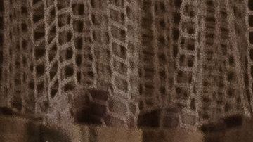 A health care worker tends to a Covid-19 patient while she is using a continuous positive airway pressure (CPAP) machine to help with her breathing difficulties in a Covid-19 holding pod at Providence St. Mary Medical Center in Apple Valley, California on January 11, 2021. - As Covid-19 tears through southern California, small hospitals in rural towns like Apple Valley have been overwhelmed, with coronavirus patients crammed into hallways, makeshift ICU beds and even the pediatric ward. When AFP visited St Mary hospital in this desert town of 70,000 people this week, palliative care supervisor Kari McGuire said her team were seeing "astronomical numbers of patients who are dying" from the novel coronavirus. (Photo by ARIANA DREHSLER / AFP) (Photo by ARIANA DREHSLER/AFP via Getty Images)