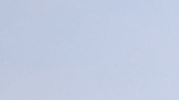 LAPD police cars block the corner of Fairfax Avenue and Sunset Boulevard where a body covered in a white sheet lies under a tent in Los Angeles on April 24, 2021 in what appears to be an officer-involved shooting. - On the evening of the shooting the LAPD official twitter account read: There has been an Officer-Involved Shooting on Sunset Blvd. near Fairfax in Hollywood Division. Around 2:35 p.m. officers were heading to a radio call with their lights and sirens on when a car pulled in front of them, stopped suddenly and reversed into the police car. The driver of the car exited, was wearing body armor, and had his right hand concealed behind him. He moved toward the officers who had exited their patrol car. He counted "3, 2, 1" and began to move his arm to the front of his body, at which time there was an officer involved shooting. The man was struck by gunfire and pronounced deceased at scene. Force Investigation Division detectives are on scene conducting interviews and gathering evidence.The man who was shot and killed by the Los Angeles Police Department has been identified as 34-year-old Richard Solitro. (Photo by VALERIE MACON / AFP) (Photo by VALERIE MACON/AFP via Getty Images)