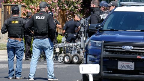 Emergency responders and San Jose Bomb Squad respond to a fire at the house of the suspect of a shooting, after nine people were reported dead including the shooter on May 26, 2021 at the San Jose Railyard in San Jose, California. - Multiple people were killed in a shooting Wednesday at a rail yard in California's Bay Area, police said, the latest instance of deadly gun violence in the United States. "I can't confirm the exact number of injuries and fatalities. But I will tell you that there are multiple injuries and multiple fatalities in this case," Russell Davis, a Santa Clara County Sheriff's deputy, told journalists, adding that the gunman was dead. (Photo by Amy Osborne / AFP) (Photo by AMY OSBORNE/AFP via Getty Images)