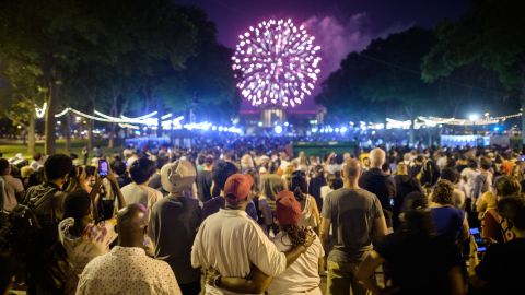Spectators watch the annual Independence Day fireworks display outside the Philadelphia Museum of Art in Philadelphia on July 4, 2021. (Photo by Ed JONES / AFP) (Photo by ED JONES/AFP via Getty Images)