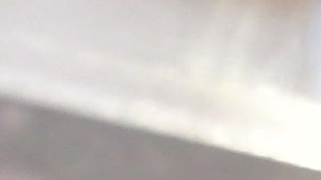 A man wears his mask as he walks past a sign posted on a storefront reminding people to wear masks, on February 25, 2022 in Los Angeles, - Los Angeles ends its indoor mask mandate on February 25 for the fully vaccinated and can show proof. The wearing of masks indoors remains for the unvaccinated and fail to show proof of a negative test. (Photo by Frederic J. BROWN / AFP) (Photo by FREDERIC J. BROWN/AFP via Getty Images)