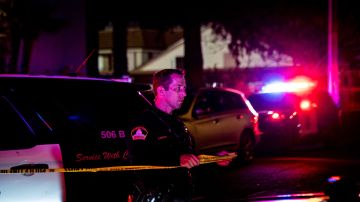 A Sacramento County Sheriff's Department officer tapes off a crime scene outside a church where a man shot dead four people, including three of his children, before turning the gun on himself, February 28, 2022 in Sacramento, California. - A father shot dead three of his own children on February 28 before turning the gun on himself in a US church, police said. A fifth person also died in the shooting in Sacramento, California, though it was not clear if that person was related to what police said was a domestic incident. (Photo by Andri Tambunan / AFP) (Photo by ANDRI TAMBUNAN/AFP via Getty Images)