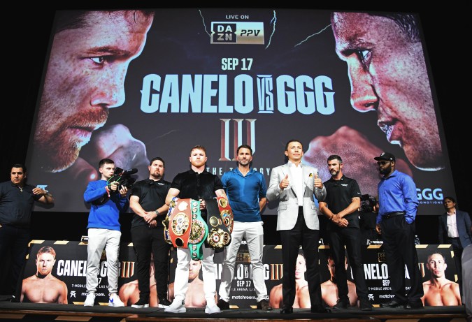 HOLLYWOOD, CA - JUNE 24: Boxer Canelo Alvarez (3rd L) and Gennady Golovkin (3rd R) pose, with boxing promotor Eddie Hearn (C) during a news conference on June 24, 2022 in Hollywood, California. Alvarez and Golovkin will meet in a Las Vegas, Nevada on September 17, 2022, for the undisputed super middleweight championship of the world. (Photo by Kevork Djansezian/Getty Images)