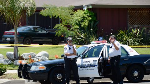 RIALTO, CA - JUNE 17: Rialto police officers and volunteers keep watch in front of Rodney King's home after he was found dead on June 17, 2012 in Rialto, California. King, whose video beating by Los Angeles police in 1991 sparked riots after the acquittal of the four officers involved, was found dead at the age of 47 from an apparent drowning in his swimming pool. (Photo by Kevork Djansezian/Getty Images)