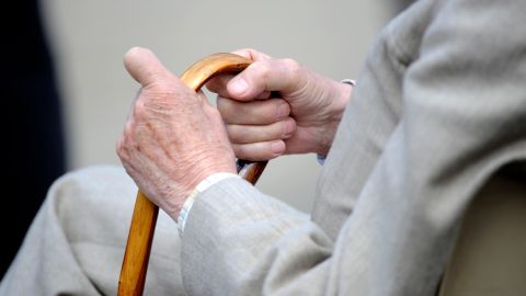 An hold man holds his stick on April 3, 2012 in Blois, central France. AFP PHOTO DAMIEN MEYER (Photo credit should read DAMIEN MEYER/AFP via Getty Images)