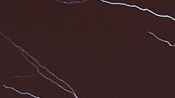 Lightning brightens the night sky over Washington, DC, during a rainstorm on April 20, 2015. AFP PHOTO / MLADEN ANTONOV (Photo by Mladen ANTONOV / AFP) (Photo credit should read MLADEN ANTONOV/AFP via Getty Images)