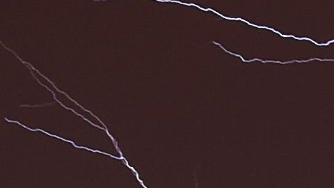 Lightning brightens the night sky over Washington, DC, during a rainstorm on April 20, 2015. AFP PHOTO / MLADEN ANTONOV (Photo by Mladen ANTONOV / AFP) (Photo credit should read MLADEN ANTONOV/AFP via Getty Images)