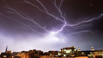 Lightning brightens the night sky over Washington, DC, during a rainstorm on April 20, 2015. AFP PHOTO / MLADEN ANTONOV (Photo by Mladen ANTONOV / AFP) (Photo credit should read MLADEN ANTONOV/AFP via Getty Images)