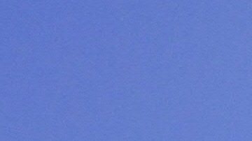 A pedestrian uses an umbrella while walking past City Hall in Los Angeles amid an ongoing heatwave on August 29, 2017, generating triple-digit temperatures in some southern California communities. Temperatures hit the mid 90F (34C). / AFP PHOTO / FREDERIC J. BROWN (Photo credit should read FREDERIC J. BROWN/AFP via Getty Images)