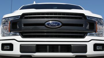 MIAMI, FL - OCTOBER 26: The front grill of a Ford F-150 pickup truck is seen on Metro Ford's sales lot on October 26, 2017 in Miami, Florida. Ford reported it's quarterly earnings per share of 39 cents, above Wall Street expectations of 33 cents driven in part by strong sales of its F-Series pickup trucks. (Photo by Joe Raedle/Getty Images)