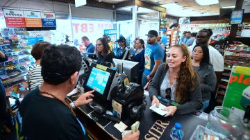 People wait in line to purchase their lottery tickets at the Blue Bird Liquor store in Hawthorne, California on October 23, 2018 ahead of the drawing tonight for the Mega Millions jackpot, now reaching USD 1.6 billion. (Photo by Frederic J. BROWN / AFP) (Photo credit should read FREDERIC J. BROWN/AFP via Getty Images)
