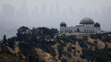 LOS ANGELES, CALIFORNIA - JULY 05: The Griffith Observatory stands (R) in front of downtown Los Angeles on July 5, 2019 in Los Angeles, California. Air quality was predicted to reach the 'unhealthy' range in the Los Angeles metropolitan area today by the South Coast Air Quality Management District following last night's fireworks. Fireworks are often launched illegally in Los Angeles. July 4th and July 5th are normally some of the worst days of the year for air quality as fireworks launch fine-particle pollution into the air. (Photo by Mario Tama/Getty Images)