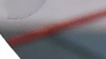 A woman receives help with a nasal swab at a BusTest Express Covid-19 mobile testing site in Paramount, a city in Los Angeles County, California, on January 12, 2022. - California Governor Gavin Newsom visited the site earlier in the day and introduced his Covid-19 emergency response kit while speaking to the media. (Photo by Frederic J. BROWN / AFP) (Photo by FREDERIC J. BROWN/AFP via Getty Images)