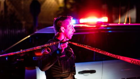 A Sacramento County Sheriff's Department officer tapes off a crime scene outside a church where a man shot dead four people, including three of his children, before turning the gun on himself, February 28, 2022 in Sacramento, California. - A father shot dead three of his own children on February 28 before turning the gun on himself in a US church, police said. A fifth person also died in the shooting in Sacramento, California, though it was not clear if that person was related to what police said was a domestic incident. (Photo by Andri Tambunan / AFP) (Photo by ANDRI TAMBUNAN/AFP via Getty Images)