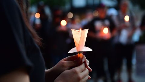 People hold candles during a vigil to mark the 33rd anniversary of the Tiananmen Square massacre in front of Chinese consulate in Los Angeles, on June 4, 2022. (Photo by Frederic J. Brown / AFP) (Photo by FREDERIC J. BROWN/AFP via Getty Images)