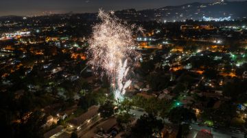 PASADENA, CA - JULY 04: In an aerial view, large illegal fireworks are set off late into the night, long after the professional Independence Day shows have ended, on July 4, 2022 in Pasadena, California. Though local fireworks complaints to police have reportedly decreased by about half this year, and by more than 80 percent since 2022, large sections of Los Angeles are home to people who come from cultures where personal fireworks are embraced. Those aerial explosives have grown bigger with time. (Photo by David McNew/Getty Images)
