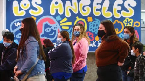 LOS ANGELES, CALIFORNIA - DECEMBER 15: People wear face coverings inside Grand Central Market on December 15, 2021 in Los Angeles, California. California residents, regardless of COVID-19 vaccination status, are required to wear face masks in all indoor public settings beginning today in response to rising coronavirus case numbers and the omicron threat. The statewide mandate will be in effect through January 15, 2022. (Photo by Mario Tama/Getty Images)