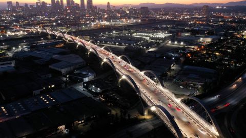 LOS ANGELES, CALIFORNIA - JULY 11: An aerial view of vehicles passing over the newly-opened 6th Street Viaduct, connecting Boyle Heights with downtown L.A., on July 11, 2022 in Los Angeles, California. The $588-million project which opened over the weekend took six years to finish and is designed to withstand a magnitude 9.0 earthquake. The original viaduct was constructed in 1932 and demolished in 2016 after it was determined to be seismically-deficient. (Photo by Mario Tama/Getty Images)