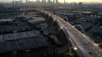 LOS ANGELES, CALIFORNIA - JULY 11: An aerial view of vehicles passing over the newly-opened 6th Street Viaduct, connecting Boyle Heights with downtown L.A., on July 11, 2022 in Los Angeles, California. The $588-million project which opened over the weekend took six years to finish and is designed to withstand a magnitude 9.0 earthquake. The original viaduct was constructed in 1932 and demolished in 2016 after it was determined to be seismically-deficient. (Photo by Mario Tama/Getty Images)