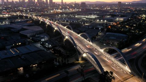 LOS ANGELES, CALIFORNIA - JULY 11: An aerial view of vehicles passing over the newly-opened 6th Street Viaduct, connecting Boyle Heights with downtown L.A., on July 11, 2022 in Los Angeles, California. The $588-million project which opened over the weekend took six years to finish and is designed to withstand a magnitude 9.0 earthquake. The original viaduct was constructed in 1932 and demolished in 2016 after it was determined to be seismically-deficient. (Photo by Mario Tama/Getty Images)