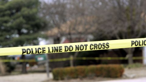 PARK CITY, KS - FEBRUARY 26: Police tape hangs across the street in front of the house that Dennis Rader lives in February 26, 2005 in Park City, Kansas. Rader is the suspect whom police have arrested on suspicion of first-degree murder in connection with the 10 deaths now tied to the serial killer known as BTK. (Photo by Larry W. Smith/Getty Images)