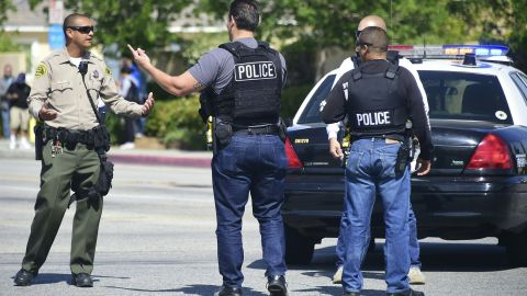 Police man an intersection May 11, 2018 following reports of shooting at Highland High School in Palmdale, 40 miles (65 kilometers) north of downtown Los Angeles. - Police arrested a man after reports of shootings at two schools near Los Angeles, the local sheriff's department and education officials said. The Los Angeles County Sheriff said one suspect had been detained "regarding the person with a gun" at Highland High School. Local news reports had earlier said that at least one person had been wounded. It was not immediately clear what type of weapon the man had. (Photo by Frederic J. BROWN / AFP) (Photo credit should read FREDERIC J. BROWN/AFP via Getty Images)