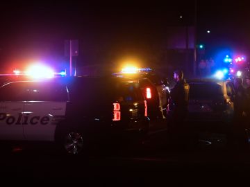 TOPSHOT - Police officers are seen at the intersection of US 101 freeway and the Moorpark Rad exit as police vehicles close off the area responding to a shooting at a bar in Thousand Oaks, California on November 8, 2018. - Twelve people, including a police sergeant, were shot dead in a shooting at a nighttclub close to Los Angeles, police said Thursday. All the victims were killed inside the bar in the suburb of Thousand Oaks late on Wednesday, including the officer who had been called to the scene, Sheriff Geoff Dean told reporters. The gunman was also dead at the scene, Dean added. The bar was hosting a college country music night. (Photo by Frederic J. BROWN / AFP) (Photo credit should read FREDERIC J. BROWN/AFP via Getty Images)