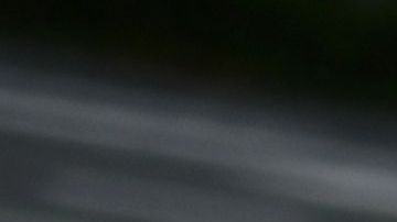 An elderly woman wearing a face mask crosses a street in Tokyo's Tsukiji area on March 27, 2020. (Photo by CHARLY TRIBALLEAU / AFP) (Photo by CHARLY TRIBALLEAU/AFP via Getty Images)