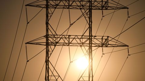 Electrical power line towers are seen in Los Angeles, California, August 19, 2020 during a triple-digit heatwave gripping the area. - Hundreds of thousands of California residents are at risk of losing power in rolling blackouts as the state grapples with record-breaking heat wave and wildfires burning across the state. (Photo by Robyn Beck / AFP) (Photo by ROBYN BECK/AFP via Getty Images)