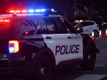 Beverly Hills police officers patrol in their car on November 1, 2020 in Beverly Hills. (Photo by Chris DELMAS / AFP) (Photo by CHRIS DELMAS/AFP via Getty Images)