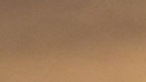 People view the sun set as a child drinks from a water bottle on June 15, 2021 in Los Angeles, California as temperatures soar in an early-season heatwave. (Photo by Frederic J. BROWN / AFP) (Photo by FREDERIC J. BROWN/AFP via Getty Images)