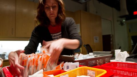 TO GO WITH AFP STORY by Laurent VU THE, Canada-society-drugs-health A worker at the Insite supervised injection Center in Vancouver, Canada, arranges syringes to be used by addicts on May 3, 2011. The Canadian Supreme Court is to settle a conflict between the government's wishes to close the center and the center's success in fighting the spread of AIDS among drug addicts. In eight years of existence, and with more 600 visits per day on average, Insite believes it has made advances in the fight against AIDS. And in a radius of 500 meters around the center, deaths by overdose dropped by 35 percent since the opening, according to a study published in the medical newspaper The Lancet. AFP PHOTO/Laurent Vu The (Photo by Laurent Vu The / AFP) (Photo by LAURENT VU THE/AFP via Getty Images)