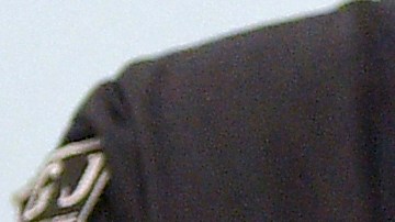 A judical officer brings handcuffed defendant Mohamed R. into the courtroom in Dresden, Germany, on March 15, 2022, for the continuation of the trial over a jewellery heist on the Green Vault (Gruenes Gewoelbe) museum in Dresden's Royal Palace in November 2019. - Six members of a notorious criminal gang, aged 22 to 28, are on trial in Germany over the spectacular heist in which 18th-century jewels were snatched from the state museum in Dresden. They are accused of gang robbery and arson after the brazen night raid on The Green Vault museum on November 25, 2019. (Photo by MATTHIAS RIETSCHEL / POOL / AFP) (Photo by MATTHIAS RIETSCHEL/POOL/AFP via Getty Images)